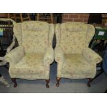 A PAIR OF MODERN UPHOLSTERED WINGBACK ARMCHAIRS