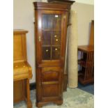 A SMALL REPRODUCTION OAK GLAZED FLOORSTANDING CORNER CABINET