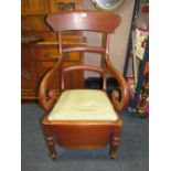 AN ANTIQUE MAHOGANY COMMODE ARMCHAIR