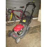 A HONDA PETROL MOWER WITH BOX