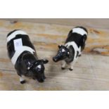 A BESWICK FRIESIAN BULL AND COW