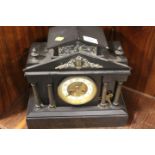 A FRENCH BLACK SLATE MANTLE CLOCK OF ARCHITECTURAL FORM