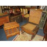 A VINTAGE COMMODE ARMCHAIR, AN OAK MAGAZINE RACK AND A DUMB WAITER (3)