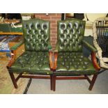 A PAIR OF REPRODUCTION GREEN LEATHER ARMCHAIRS