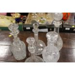 A COLLECTION OF GLASS DECANTERS TO INCLUDE CUT GLASS EXAMPLES