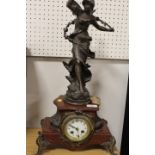 A FIGURAL FRENCH MARBLE MANTLE CLOCK WITH GILT EMBELLISHMENTS