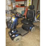 AN INVACARE MOBILITY SCOOTER WITH CHARGER