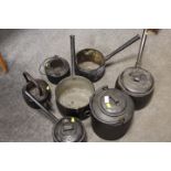 A SELECTION OF VINTAGE CAST AND ENAMEL COOKING POTS AND PANS ETC