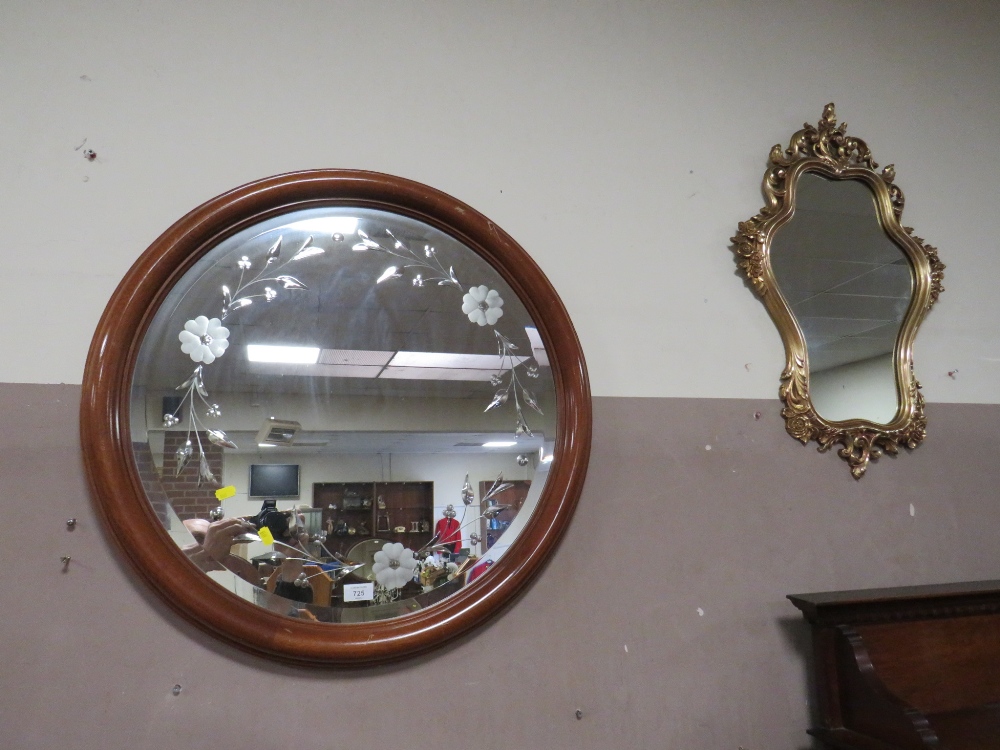 A LARGE CIRCULAR ETCHED MIRROR AND A GILT EXAMPLE