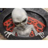 A LARGE ALIEN THEMED DECORATIVE WALL PIECE