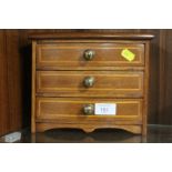 A VINTAGE STYLE MINIATURE CHEST OF DRAWERS