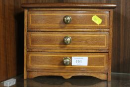 A VINTAGE STYLE MINIATURE CHEST OF DRAWERS