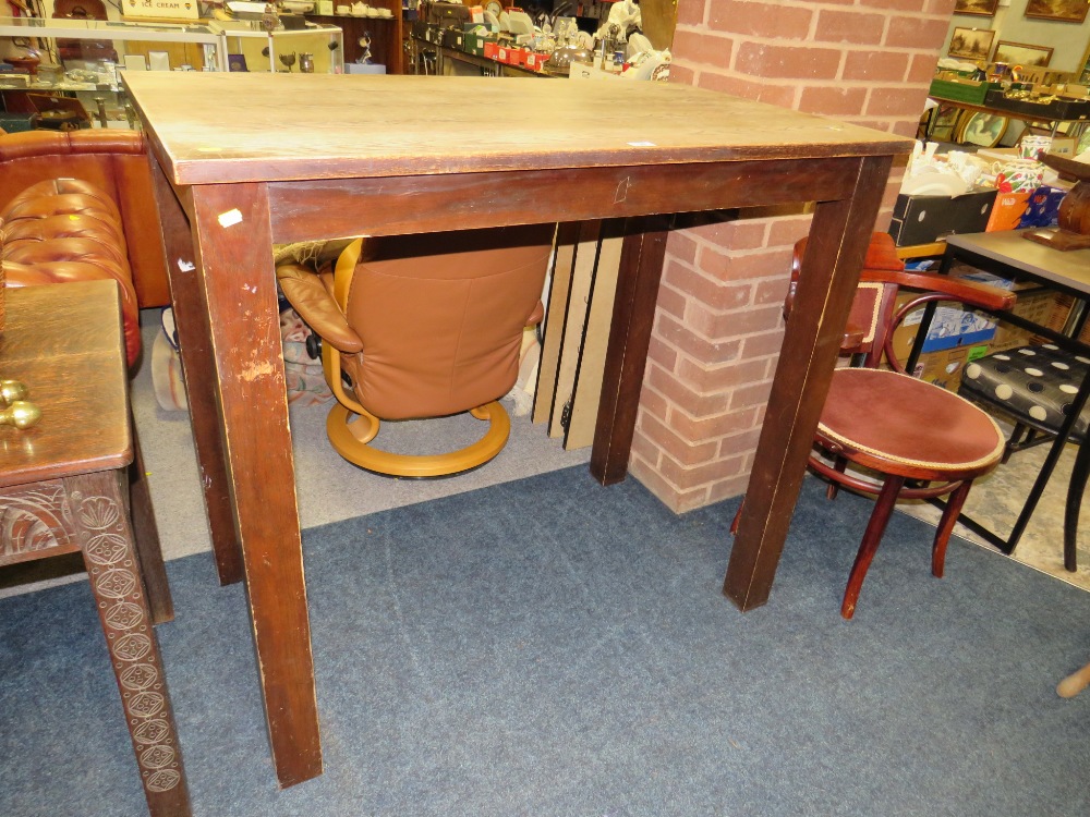 A TALL WOODEN PUB STYLE TABLE