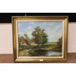 A GILT FRAMED OIL ON CANVAS OF A VILLAGE POND WITH THATCHED COTTAGE