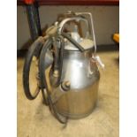 A VINTAGE STAINLESS STEEL MILK BUCKET AND CLUSTER