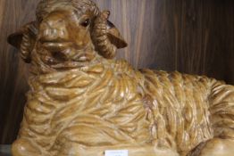 A CARVED WOODEN MODEL OF A RECUMBENT RAM