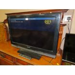 A SONY 31" FLATSCREEN TV WITH REMOTE - HOUSE CLEARANCE