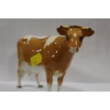 A BESWICK GUERNSEY COW