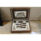 ANTIQUE MANICURE SET IN FITTED LEATHER CASE