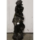 A LARGE BRONZE EFFECT MODEL OF A SEATED LADY