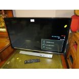 A SAMSUNG 31" FLATSCREEN TV - REMOTE - HOUSE CLEARANCE