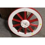 A SMALL VINTAGE PAINTED CART WHEEL