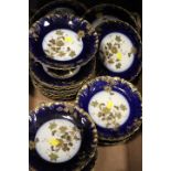 A TRAY OF CONTINENTAL BLUE AND GILT CERAMICS / DESSERT SET TO INCLUDE COMPORTS MARKED G.D.A. FRANCE