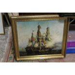 A REPRODUCTION GILT FRAMED PICTURE OF BATTLESHIPS AT WAR