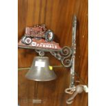 A MODERN REPRODUCTION CAST METAL WALL MOUNTED TRACTOR BELL