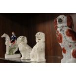 THREE MODERN REPRODUCTION STAFFORDSHIRE FLATBACK SPANIELS TOGETHER WITH A MAN ON HORSEBACK
