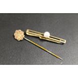 A 9CT GOLD CHESTER HALLMARKED STICK PIN TOGETHER WITH A PLATED EXAMPLE (2)