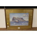 A GILT FRAMED AND GLAZED WATERCOLOUR OF A SAILING BOAT IN FRONT OF THE ROCK OF GIBRALTAR, SIGNED