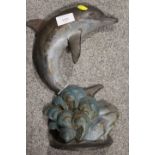 A CAST METAL LEAPING DOLPHIN DOOR STOP