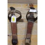 A PAIR OF EASTERN DAGGERS IN LEATHER SHEATHS WITH ARMBANDS