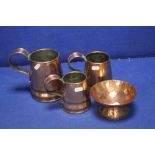 A GRADUATED SET OF THREE COPPER TANKARDS TOGETHER WITH A COPPER BOWL