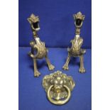 A PAIR OF BRASS FIRE DOGS TOGETHER WITH A LARGE BRASS LIONS HEAD DOOR DOOR KNOCKER
