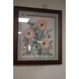 A WOODEN FRAMED FLOWER DISPLAY UNDER GLASS