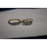 TWO DIAMOND SET YELLOW METAL RINGS SIZE M AND L