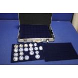 A CASE CONTAINING A SELECTION OF SILVER PROOF COINS