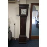 AN OAK CASED GRANDFATHER CLOCK