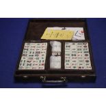 A VINTAGE MAH JONG SET IN GINO FERANI LEATHER CARRY CASE