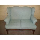 AN ANTIQUE 2 SEATER SOFA WITH GABMOCE SUPPORT