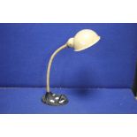 AN EARLY 20TH CENTURY ANGLE POISE DESK LAMP WITH CAST IRON BASE MARKED SUPREME