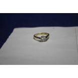 A DIAMOND SET YELLOW METAL RING SIZE L