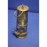 A BRASS ECCLES MINORS LAMP