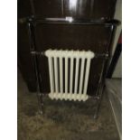 A VICTORIAN STYLE RADIATOR TOGETHER WITH OTHER RADIATORS ETC