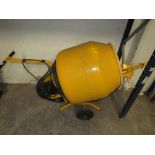 A YELLOW CEMENT MIXER