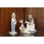 A VINTAGE LLADRO FIGURINE OF A GIRL NURSING HER DOG TOGETHER WITH A NAO FIGURE (2)