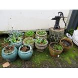 A QUANTITY OF GARDEN URNS, PLANTERS AND A CAST PUMP (12)