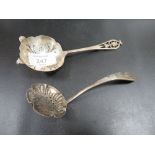 A HALLMARKED SILVER SIFTER LADLE TOGETHER WITH A SILVER PLATED EXAMPLE (2)